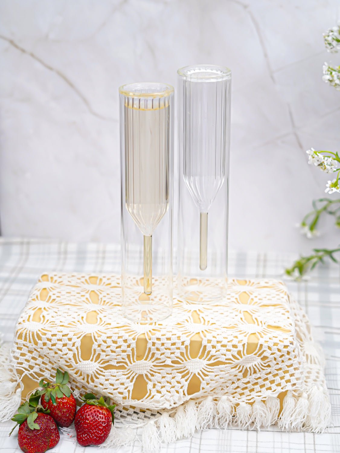 Set of double-walled champagne flutes, designed to keep drinks chilled longer while adding a touch of luxury.