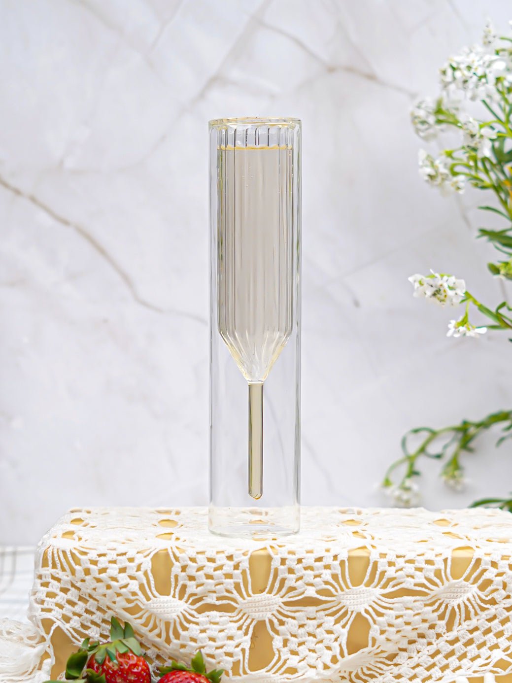 Detailed view of a double-walled champagne flute, highlighting its premium craftsmanship and thermal design.